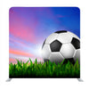 Football in Green Grass Over a Twilight Sky Background Media Wall - Backdropsource